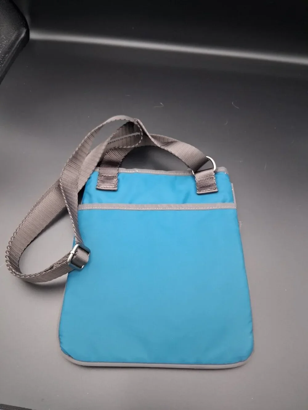 Ellington Teal Quilted Crossbody Bag with Two Front Zip Pockets. Casual style.